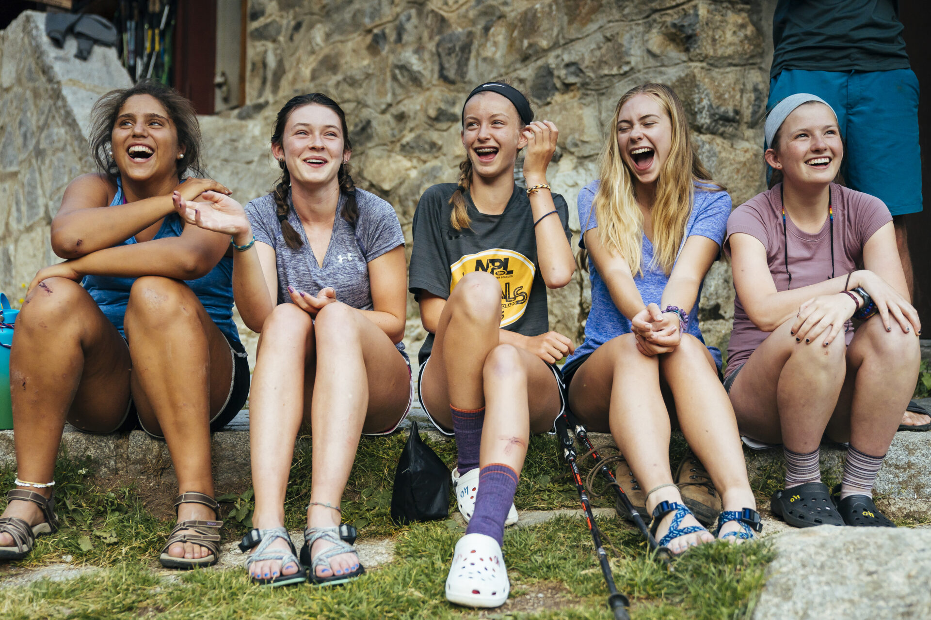 Teen adventure camp group taking a break hiking in the Spanish Pyrenees