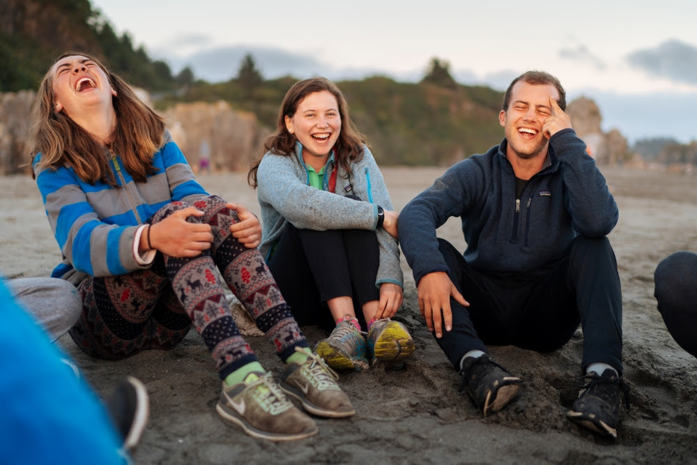 teen cycling group beach surfing summer adventure trip 